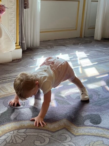 Baby Romper with traditional Peter Pan collar, front and back covered buttons, and cotton lining. Perfect for weddings, featuring snaps at legs for easy dressing. Made from high-quality Italian cotton with a satin base option