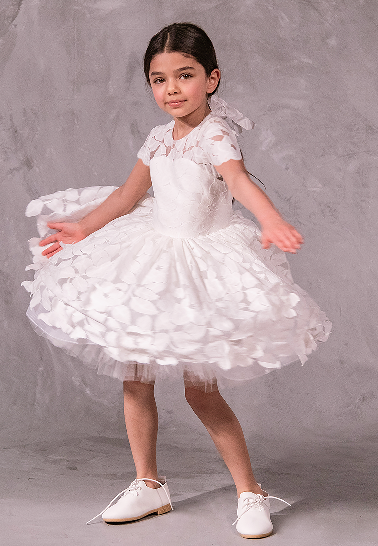 Flower girl dress in handcrafted cotton floral lace with keyhole back, pearl button, and full twirl-worthy skirt – perfect for weddings and special occasions.