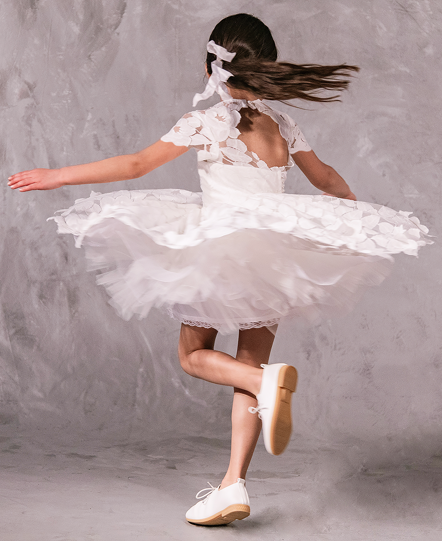 Flower girl dress in handcrafted cotton floral lace with keyhole back, pearl button, and full twirl-worthy skirt – perfect for weddings and special occasions