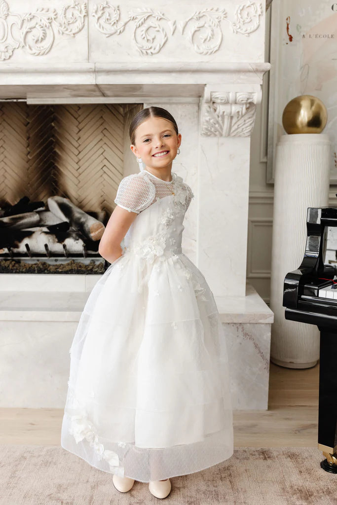 Communion and Baptism dress: Isla Rose.
Elegant custom-made white Communion and Baptism dress, featuring intricate lace details and floral embellishments.