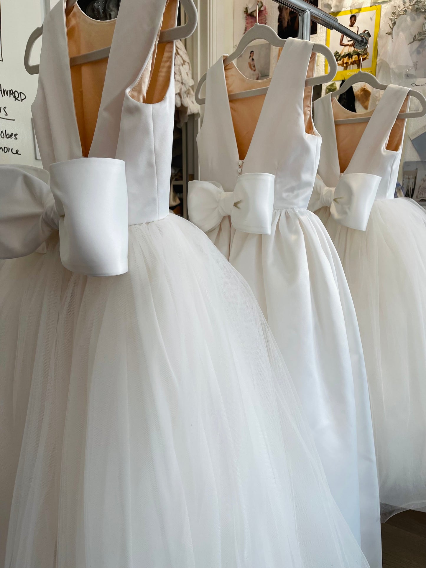 Open V-back flower girl dress with large wired bow and pearl buttons, with full skirt and satin– The Kimberly