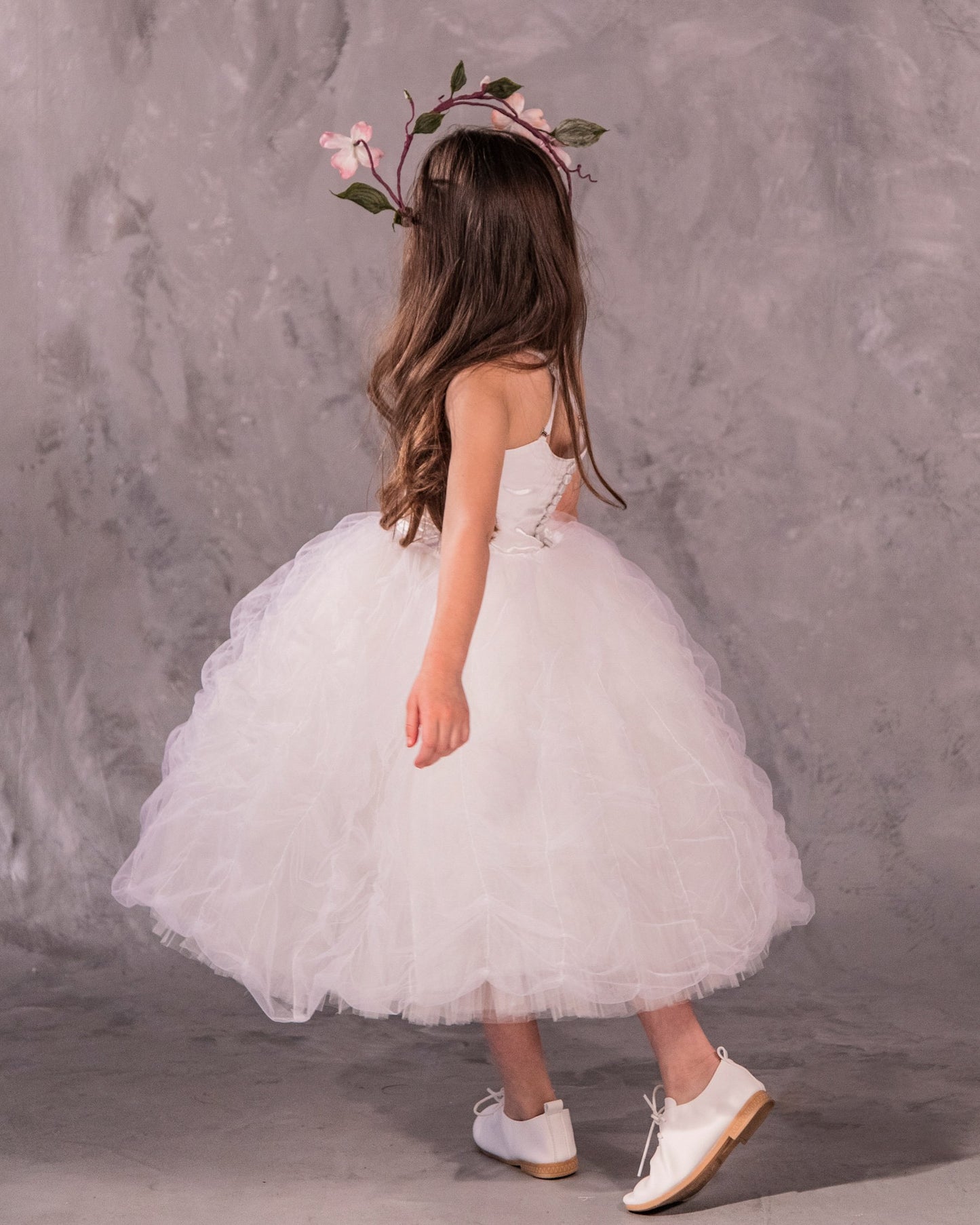 The Lauren flower girl dress with satin bodice, ethereal tulle and pleated English net skirt, grosgrain trim, and covered buttons - perfect for weddings