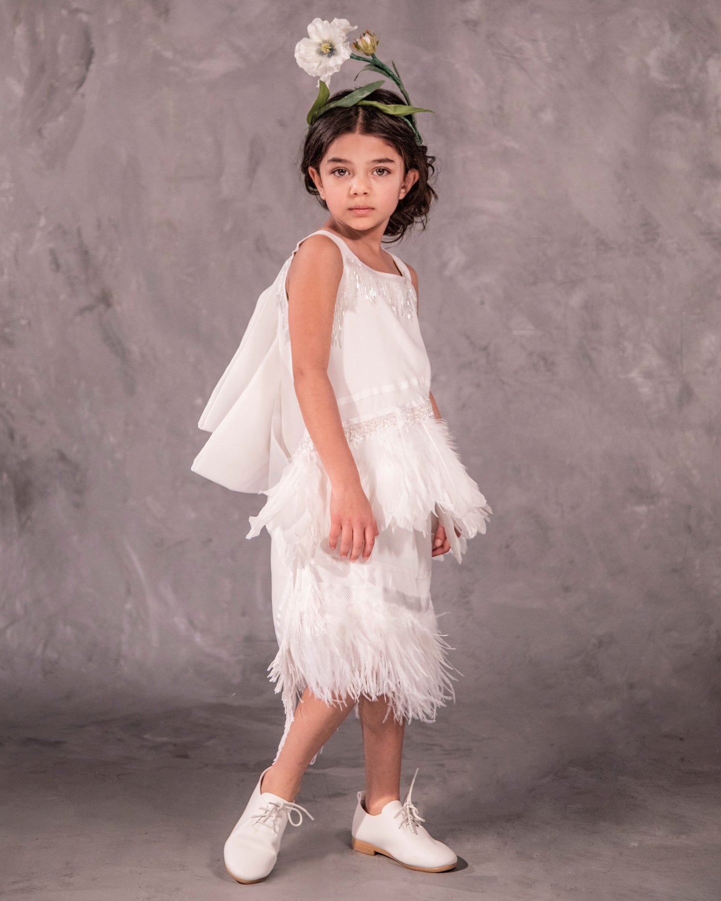 Silky fringe flower girl dress designed for bohemian and black-tie weddings