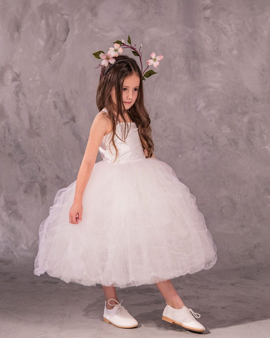 The Lauren flower girl dress with satin bodice, ethereal tulle and pleated English net skirt, grosgrain trim, and covered buttons - perfect for weddings