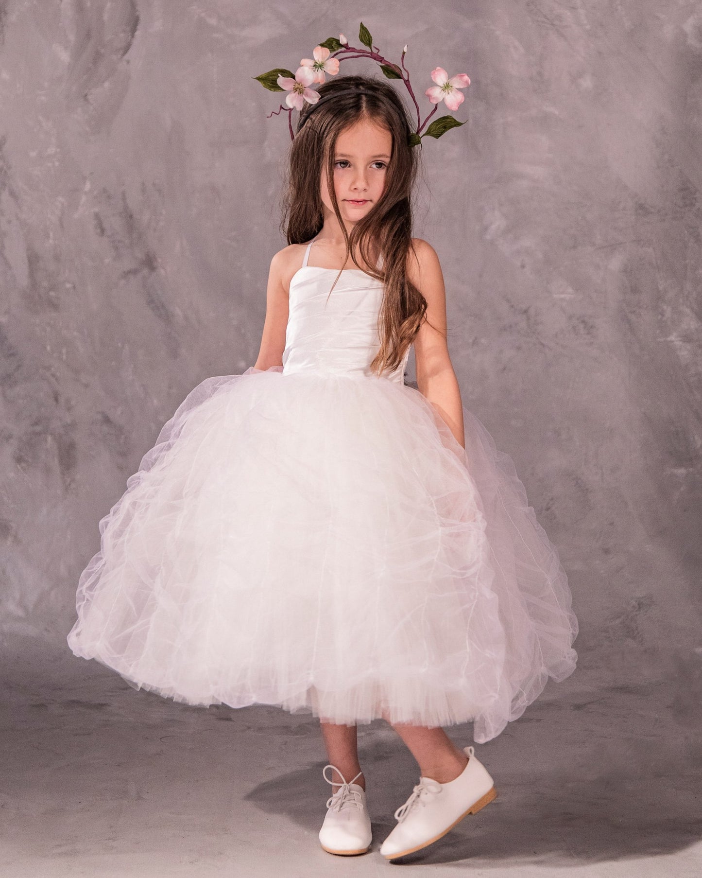 The Lauren flower girl dress with satin bodice, ethereal tulle and pleated English net skirt, grosgrain trim, and covered buttons - perfect for weddings