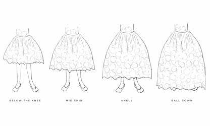 The Royal Annabelle, Annabelle & Isabelle – handcrafted cotton floral lace dress. Features a twirl-worthy full skirt, silky soft lining, and personalized embroidery. Perfect for weddings, communions, and special celebrations. Available in differents lengths: below the knee, mid shin, ankle and ball gown