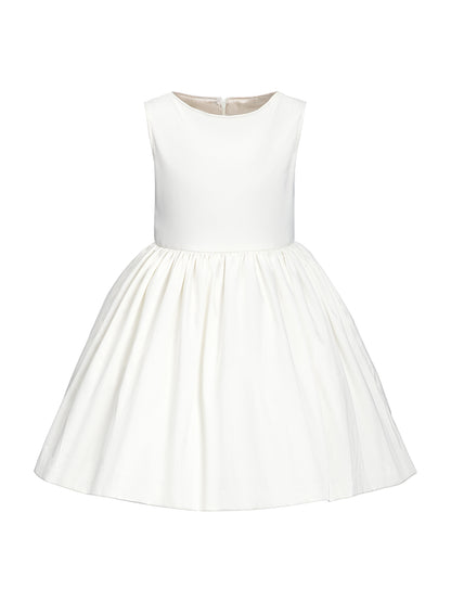 Simple white flower girl dress for minimalist wedding.
