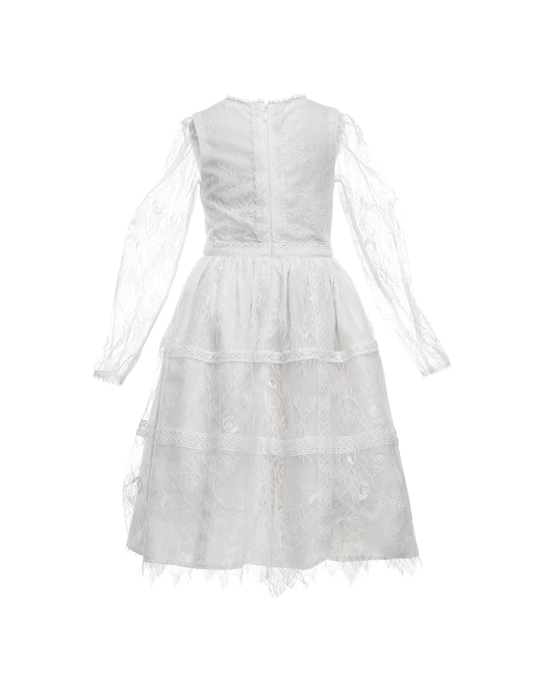 A white, vintage-style dress with sheer sleeves and lace detailing, designed for children, for bohemian and spring-summer weddings