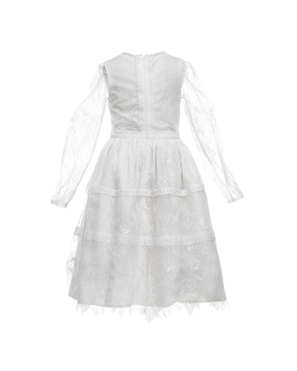 A white, vintage-style dress with sheer sleeves and lace detailing, designed for children, for bohemian and spring-summer weddings