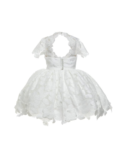 The Baby Annabelle – handcrafted cotton floral lace baby dress with a keyhole back and pearly button closure. Features a full twirl-worthy skirt, silky soft lining, and personalized embroidery. Perfect for first special occasions, weddings, communions, and celebrations