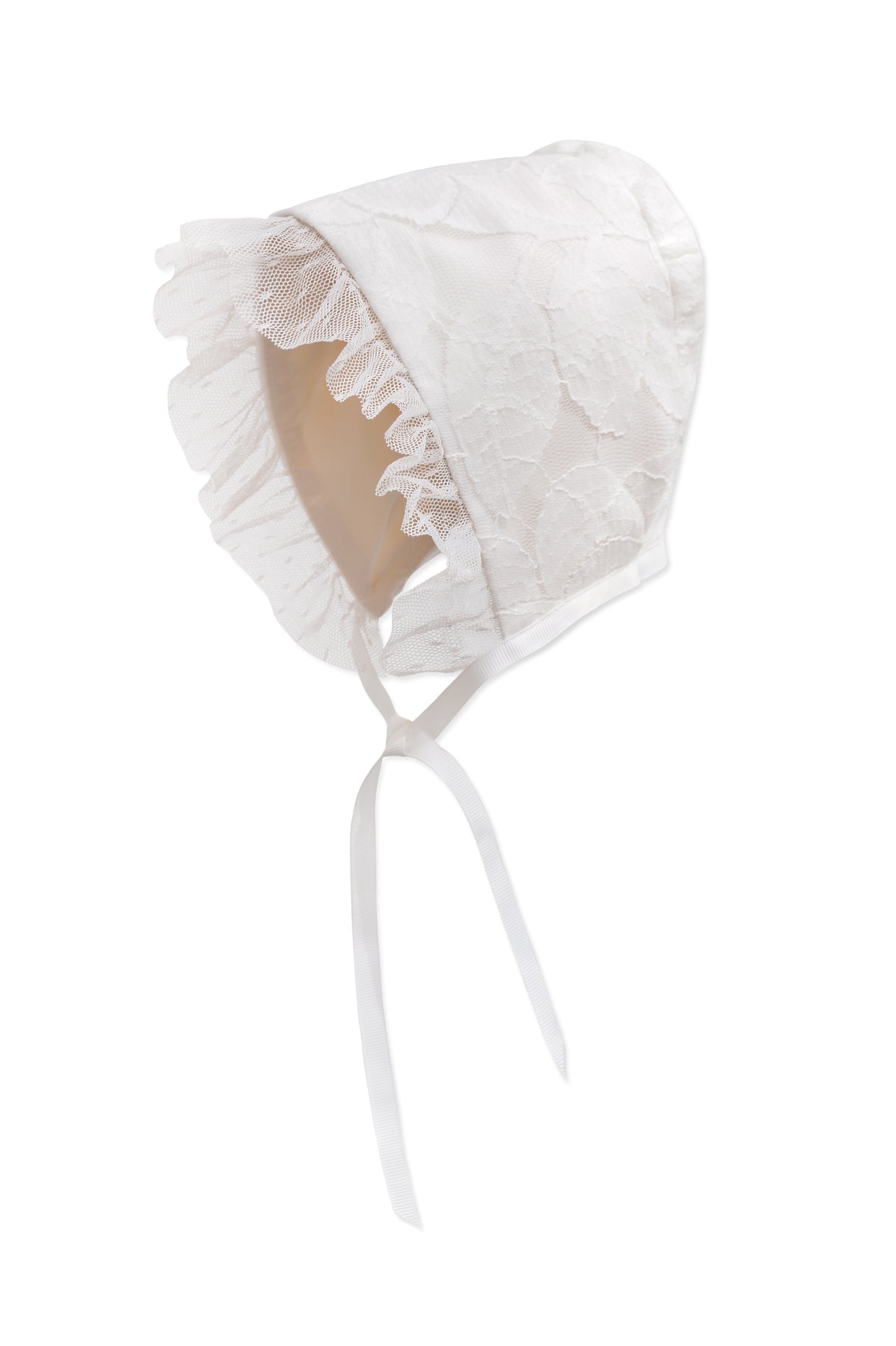Baby bonnet in hand‑cut floral cotton lace with point d’esprit trim, silk lining, and grosgrain ribbon ties by Doloris Petunia.