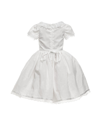 white cotton batiste flower girl dress with lace trims, short sleeves, and a knee-length skirt for summer garden wedding