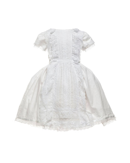 white cotton batiste flower girl dress with lace trims, short sleeves, and a knee-length skirt for summer garden wedding